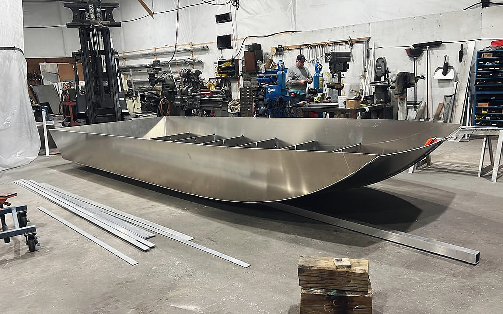 An aluminum hull taking shape on the shop floor