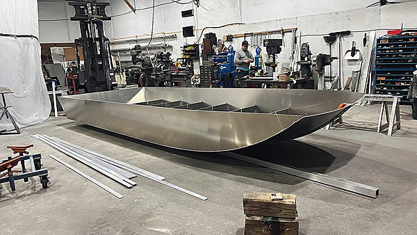 An aluminum hull taking shape on the shop floor