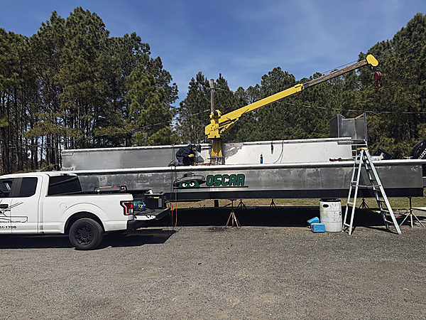 OSCAR on the stands, a welder up top, the shop truck alongside