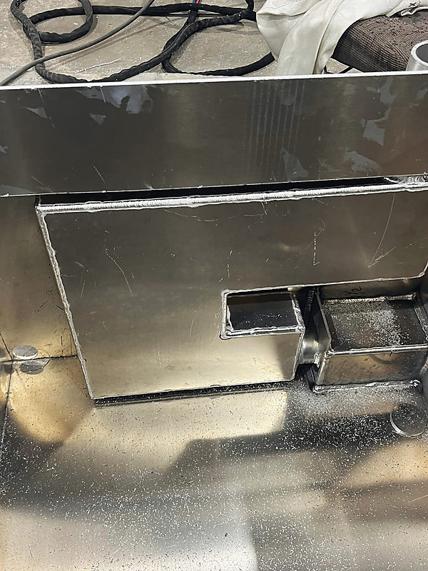 An open aluminum box, welded out
