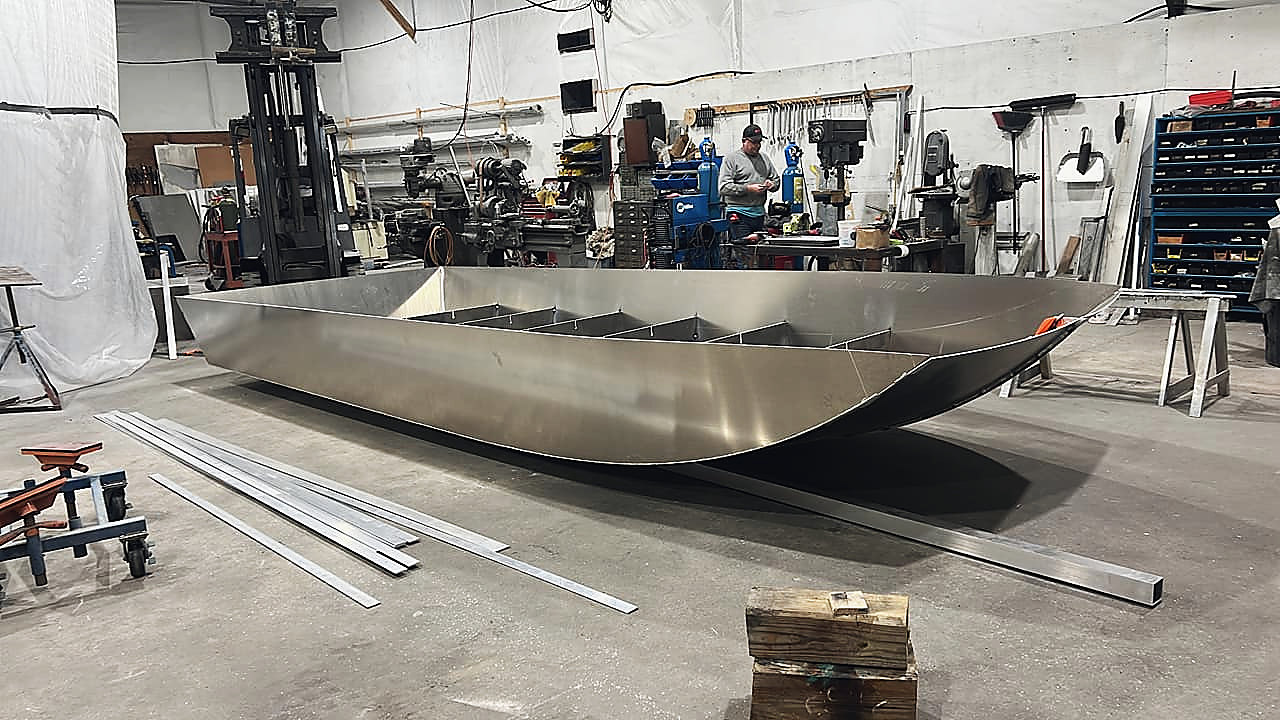 An aluminum hull taking shape on the shop floor